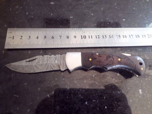 Handmade Damascus steel folding knife w Wooden Handle Scales. Pouch in bad shape, see pictures.