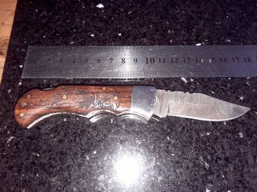 Handmade Damascus steel folding knife w Wooden Handle Scales. Pouch in bad shape, see pictures.