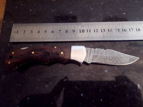 Handmade Damascus steel folding knife w Wooden Handle Scales. Pouch in bad shape, see pictures.