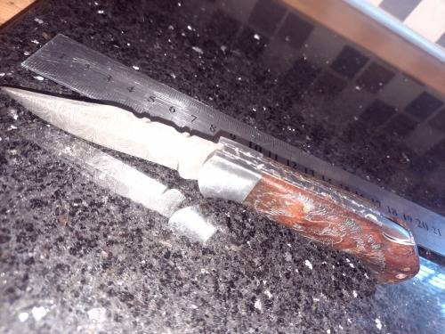 Handmade Damascus steel folding knife w Wooden Handle Scales. Pouch in bad shape, see pictures.