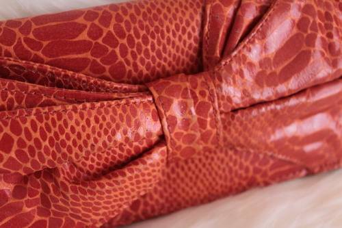 Orange Nine West Clutch with Faux Snakeskin and Bow Detail (Measures 12 x 26 cm)