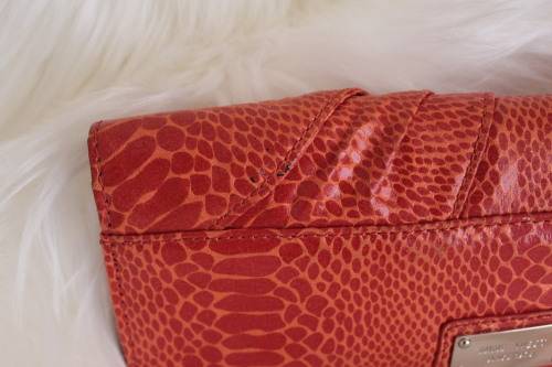 Orange Nine West Clutch with Faux Snakeskin and Bow Detail (Measures 12 x 26 cm)