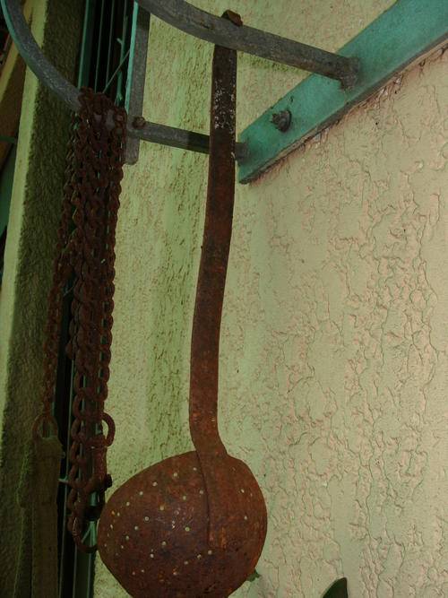 LADDLE /SIEVE  THIS OLD THING HAS LOST ALL IT ENAMEL- VERY RUSTY IDEAL FOR GARDEN BRAAI AREA