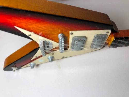MINIATURE TOY REPLICA OF THE GIBSON FLYING V ELECTRICAL GUITAR
