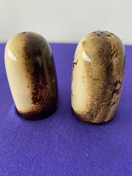CRESCENT WARE STAMPED KRUGER PARK GLAZED SET OF SALT AND PEPPER CELLARS