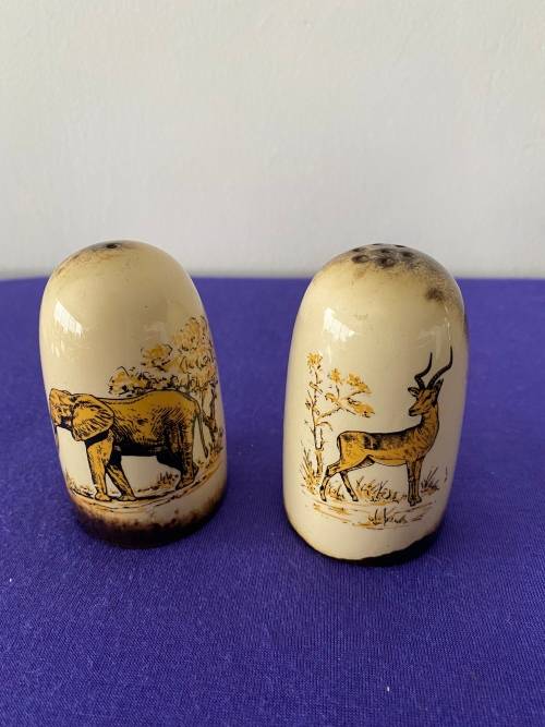 CRESCENT WARE STAMPED KRUGER PARK GLAZED SET OF SALT AND PEPPER CELLARS
