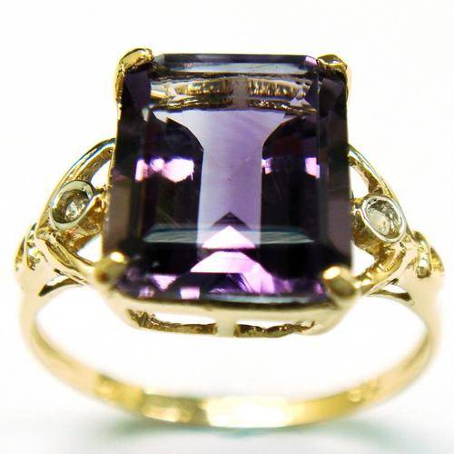 Beautiful solid 9kt gold and genuine amethyst and diamond ring.