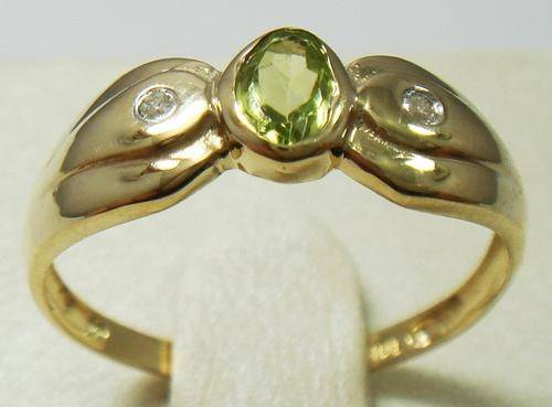 Beautiful solid 9kt gold and genuine peridot and diamond ring.