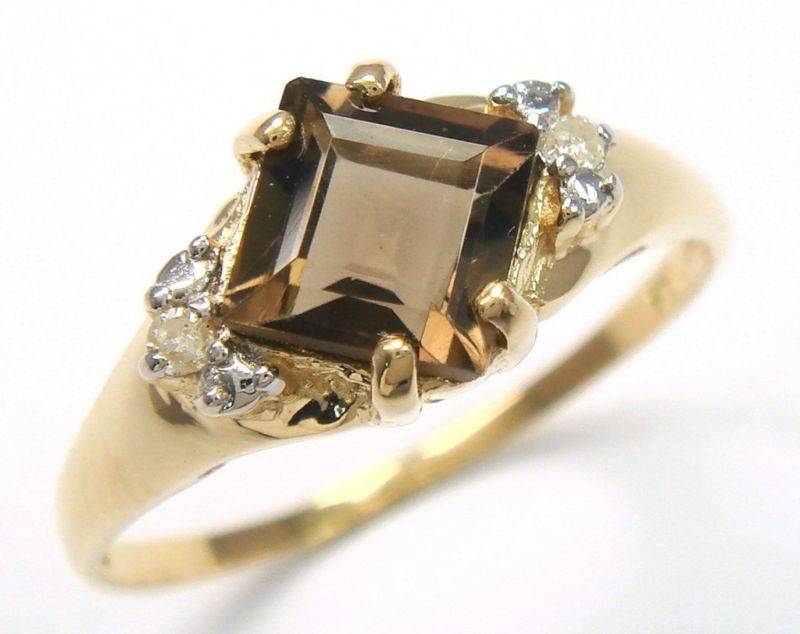 Beautiful solid 10kt gold and genuine smokey topaz and diamond ring.