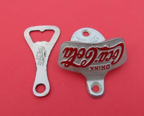 SCARCE `COCA-COLA` METAL BOTTLE OPENERS. ONE VINTAGE AND THE OTHER GENUINE AND UNUSED.