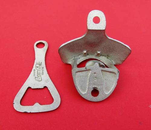 SCARCE `COCA-COLA` METAL BOTTLE OPENERS. ONE VINTAGE AND THE OTHER GENUINE AND UNUSED.