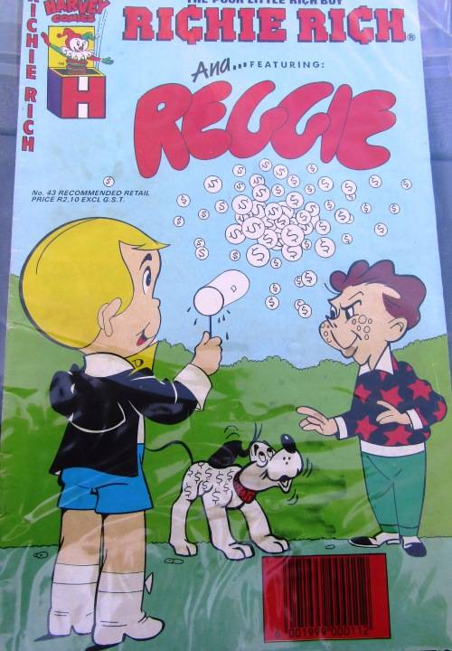 SCARCE COMIC `RICHIE RICH AND REGGIE` IN SEALED PLASTIC COVER.