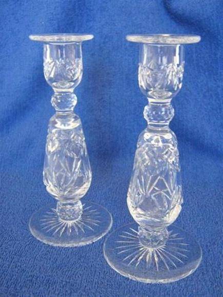 PAIR OF MATCHING CLEAR GLASS CANDLE STICKS..20.25cm HIGH X 9.50cm ACROSS THE BASE..