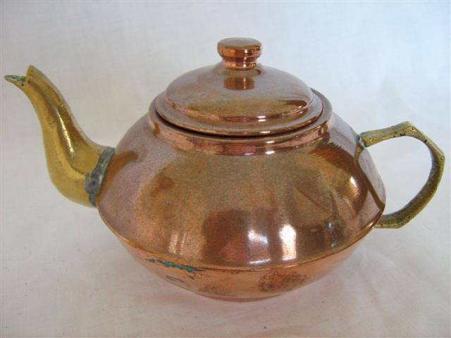 SMALL COPPER AND BRASS TEA POT..10cm HIGH X 18cm ACROSS FROM HANDLE TO SPOUT