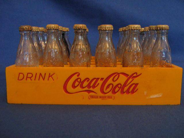 MINATURE COCA-COLA BOTTLES IN MATCHING PLASTIC CASE...