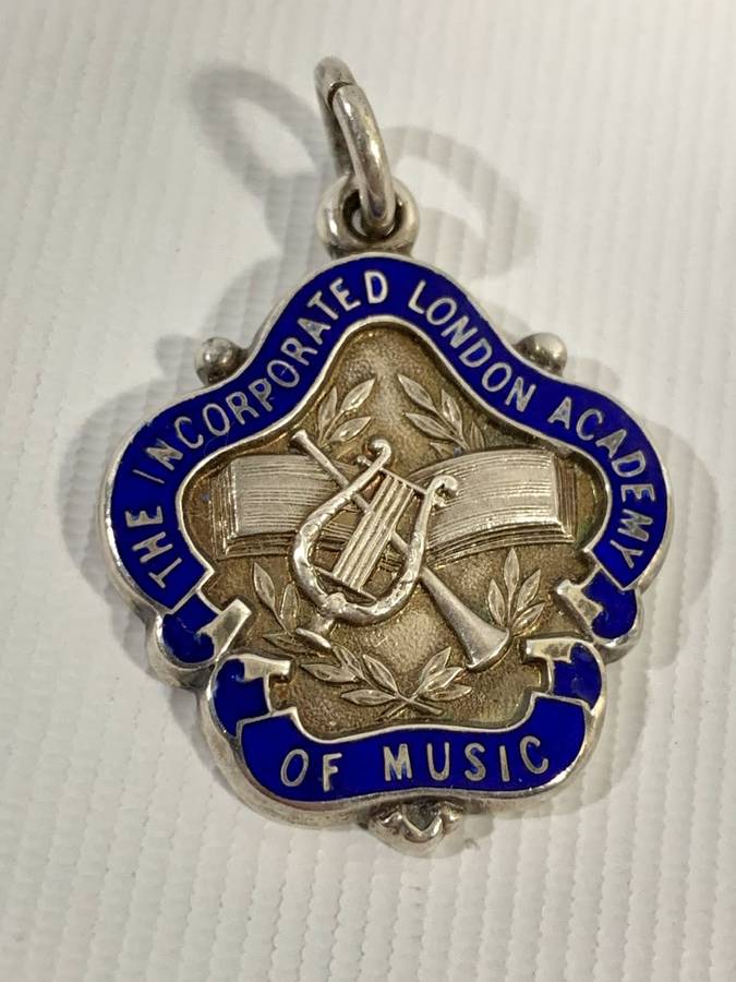 1 x Sterling Silver (13g) and 1 x Bronze Medallion