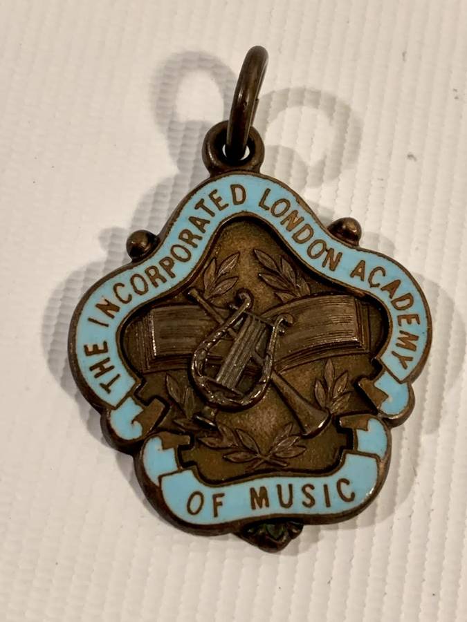 1 x Sterling Silver (13g) and 1 x Bronze Medallion