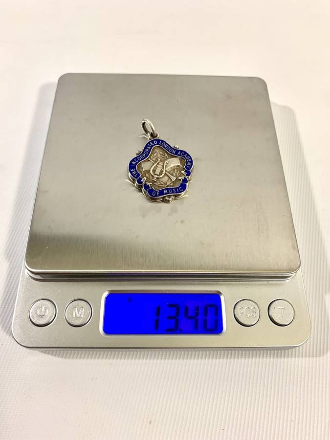 1 x Sterling Silver (13g) and 1 x Bronze Medallion