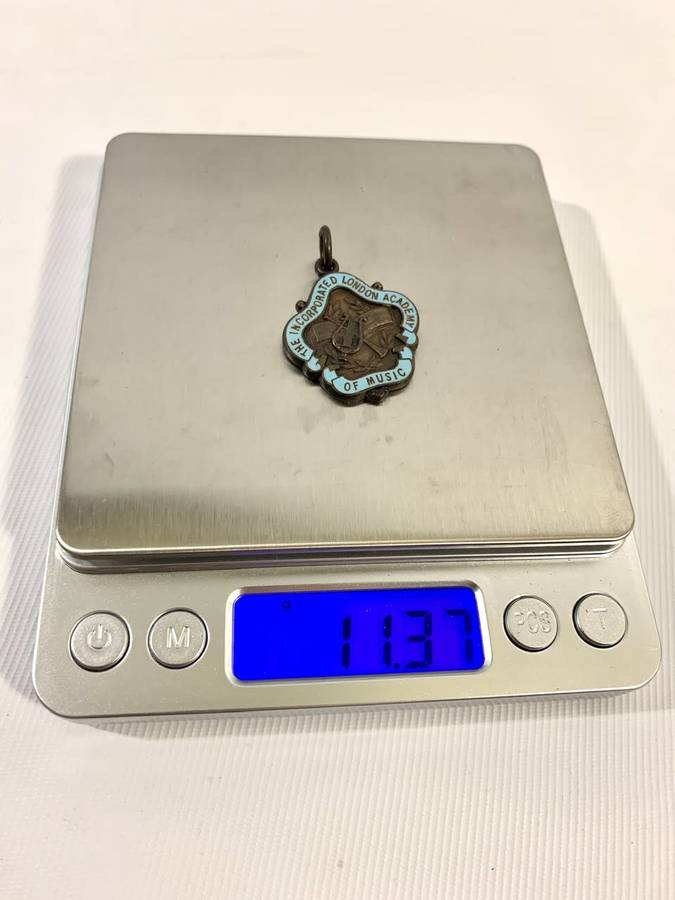 1 x Sterling Silver (13g) and 1 x Bronze Medallion