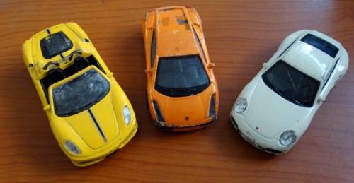 2 Bburago and 1 Uni Die Cast cars