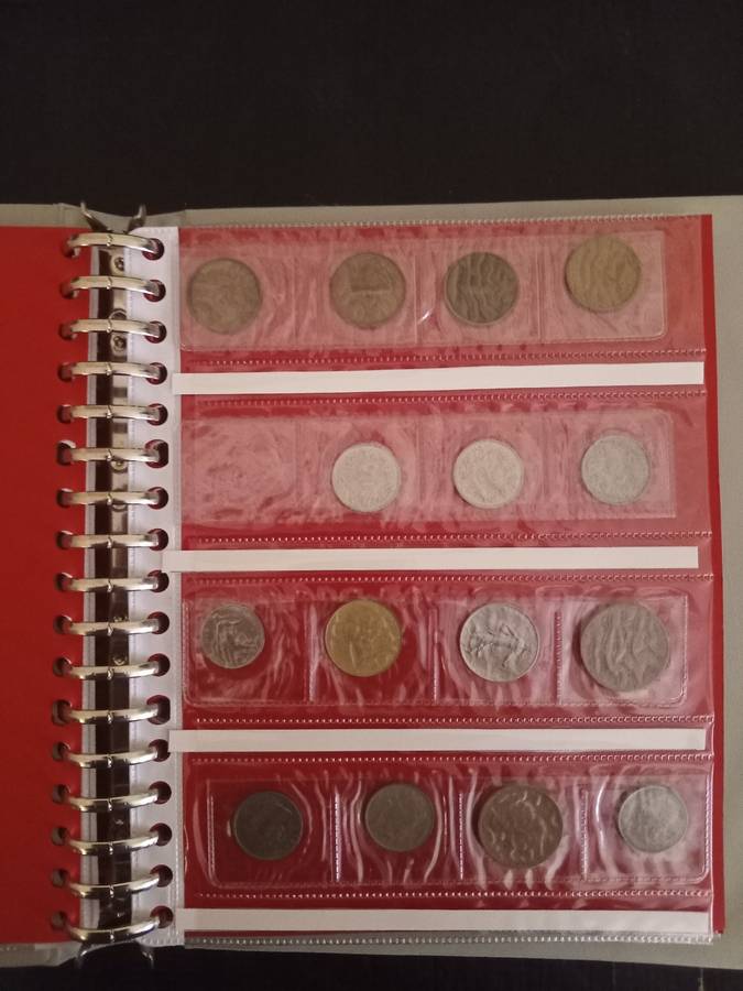 14 Page album filled with over 100 World  coins
