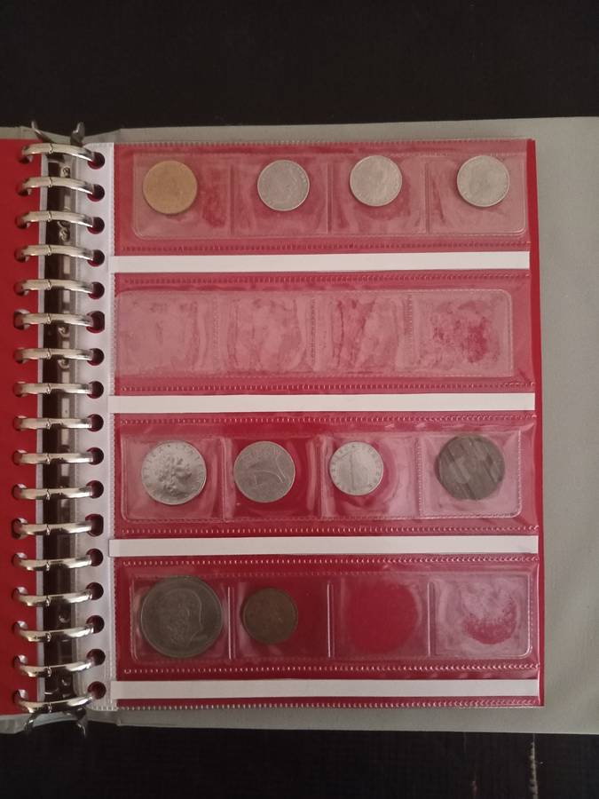 14 Page album filled with over 100 World  coins