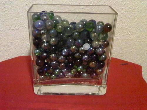 GLASS VASE WITH MARBLES