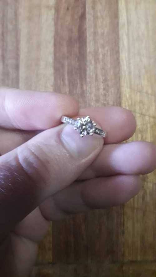 18ct White Gold Solitaire with Channel: Total Diamond weight 1.12ct with 1ct Center stone