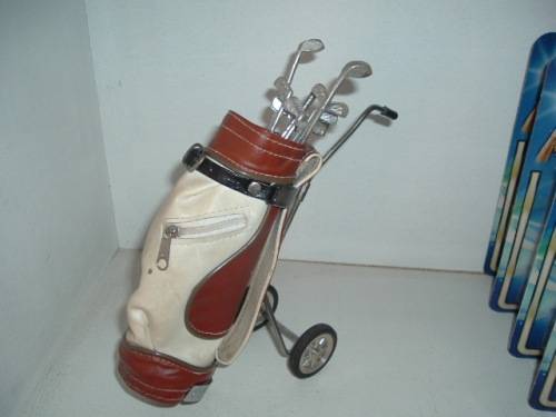 MINIATURE GOLF BAG AND CLUBS.
