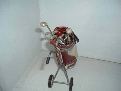 MINIATURE GOLF BAG AND CLUBS.