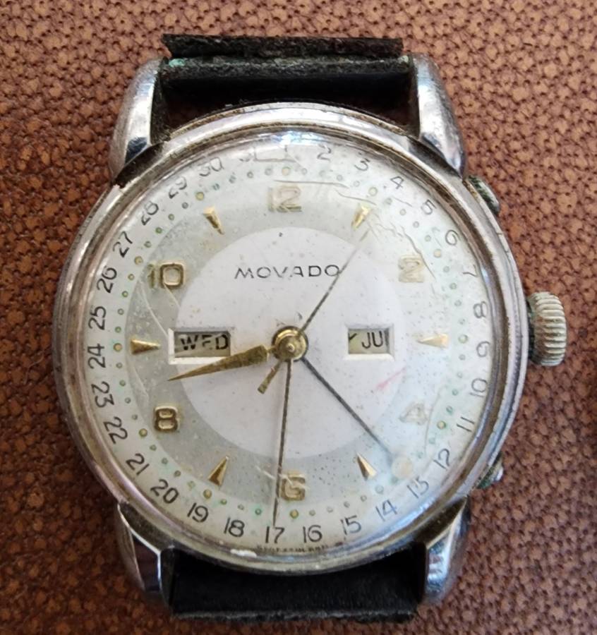 Old tin box full of watches  pocket watches, coins and pins