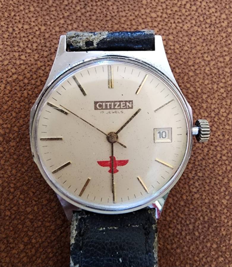 Old tin box full of watches  pocket watches, coins and pins