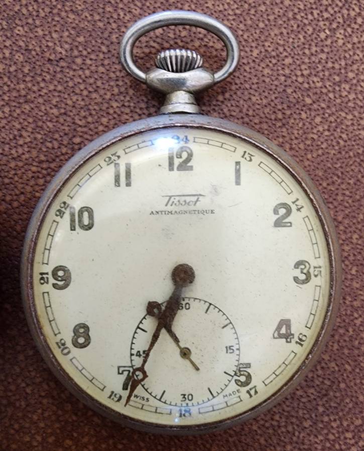 Old tin box full of watches  pocket watches, coins and pins