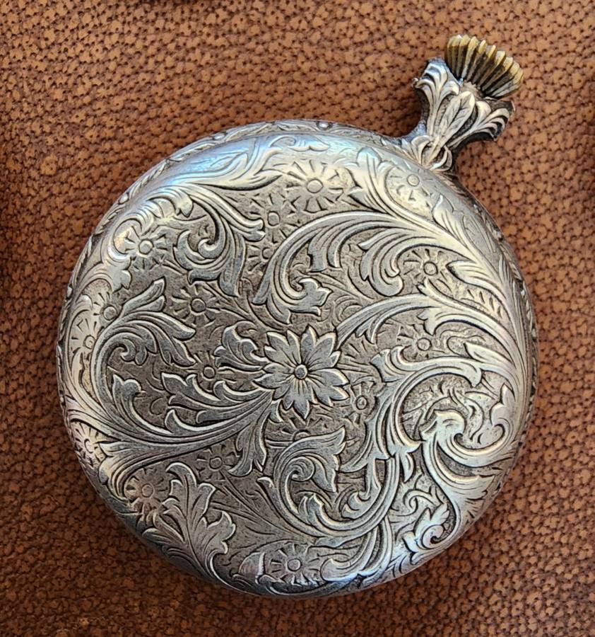 Old tin box full of watches  pocket watches, coins and pins