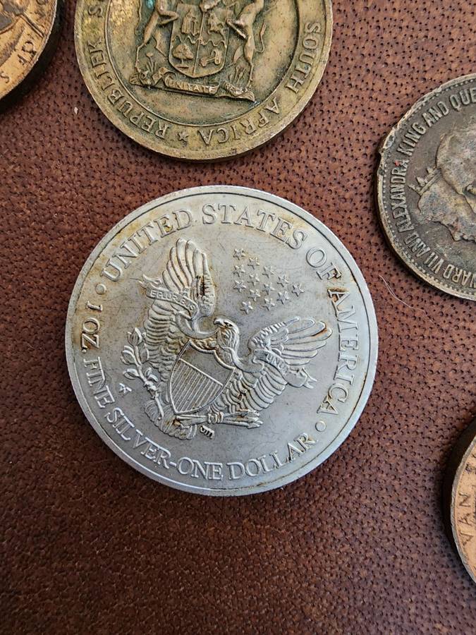 Old tin box full of watches  pocket watches, coins and pins