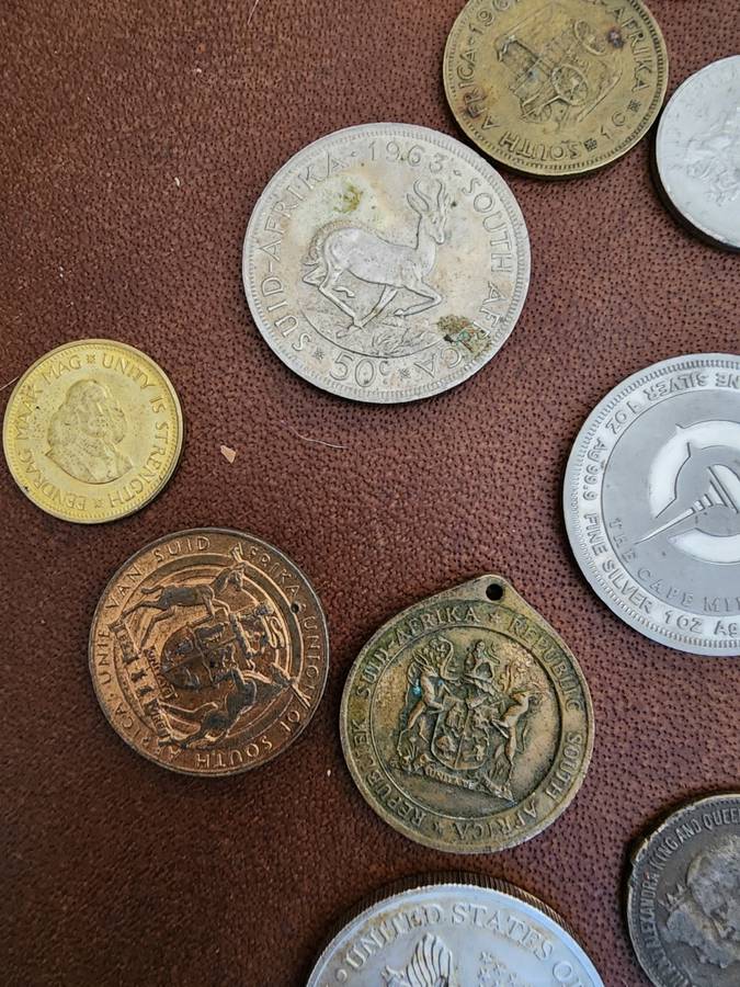 Old tin box full of watches  pocket watches, coins and pins