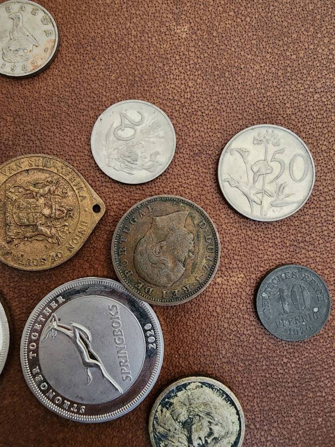 Old tin box full of watches  pocket watches, coins and pins