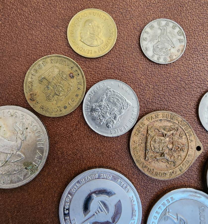 Old tin box full of watches  pocket watches, coins and pins