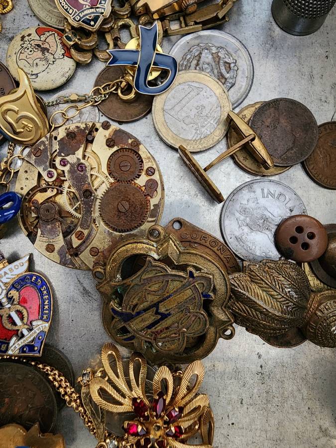 Old tin box full of watches  pocket watches, coins and pins