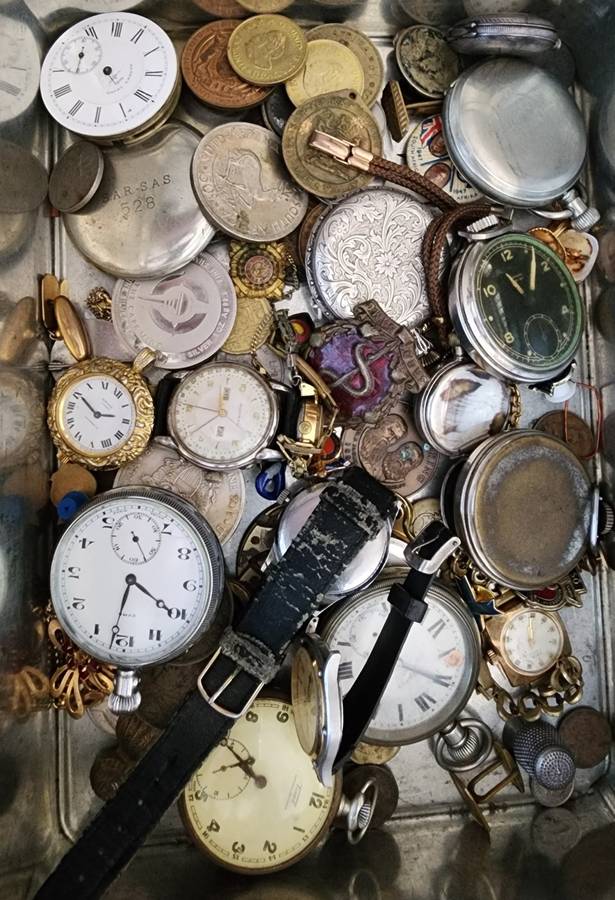 Old tin box full of watches  pocket watches, coins and pins