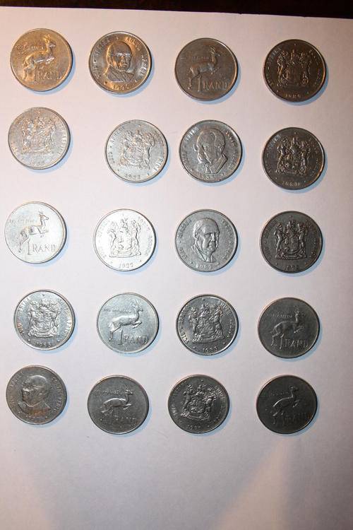 Twenty old R1.00 coins of various dates.