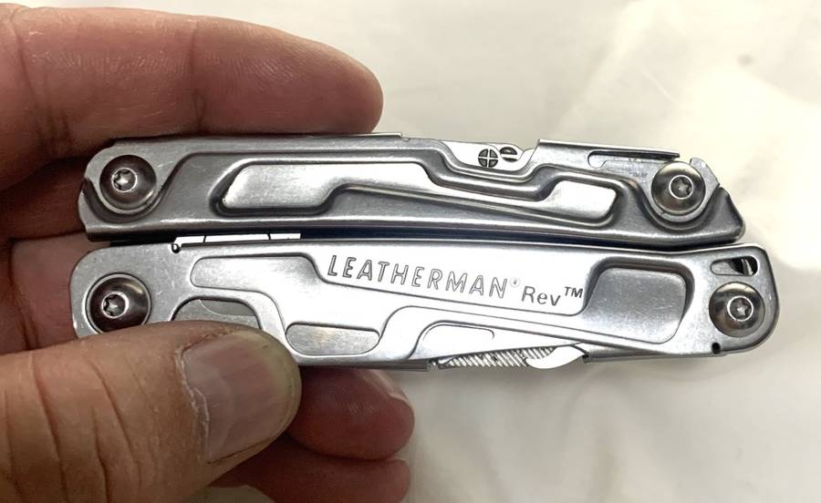 Leatherman REV Multitool knife plus generic pouch.