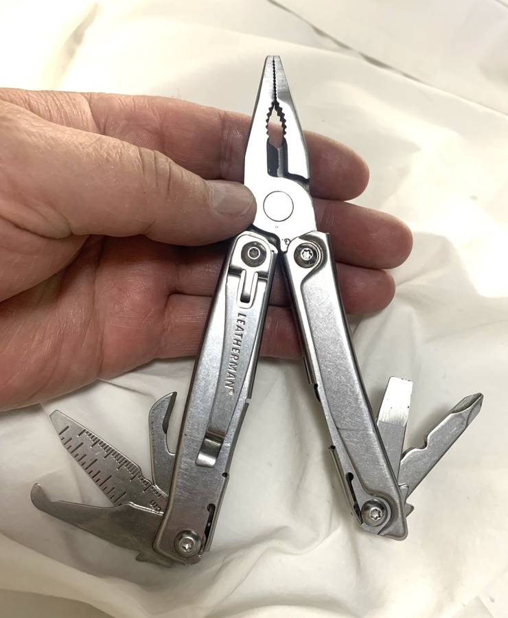Leatherman REV Multitool knife plus generic pouch.