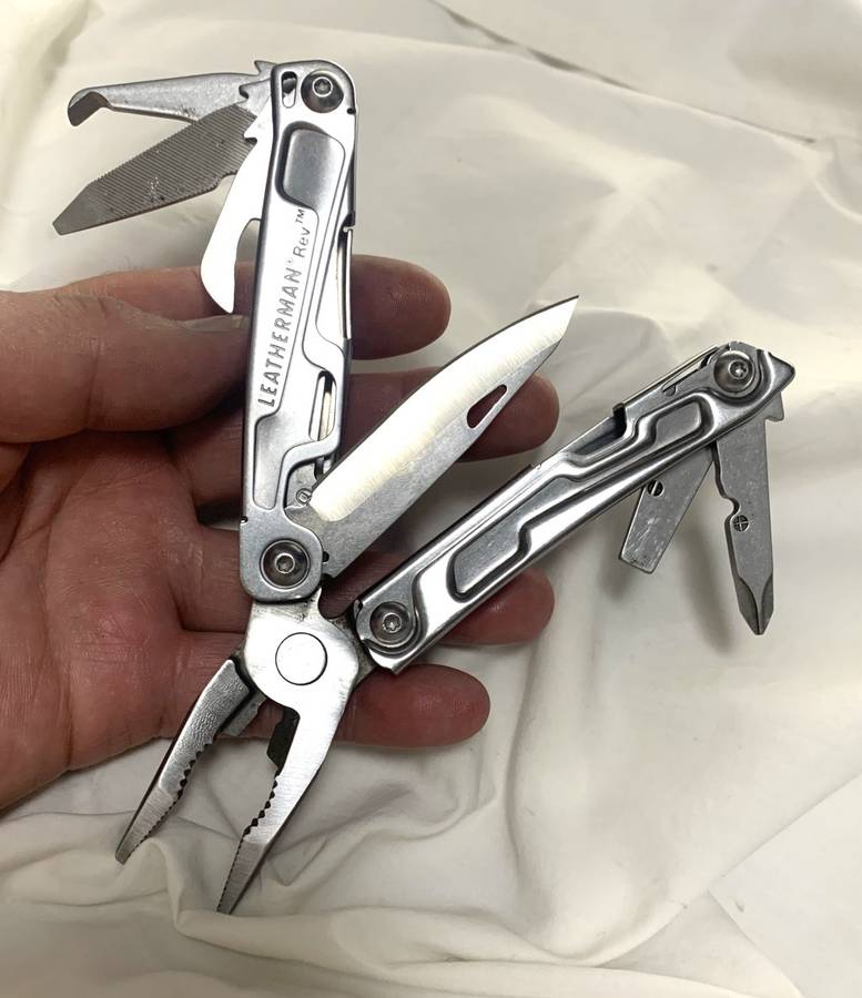 Leatherman REV Multitool knife plus generic pouch.