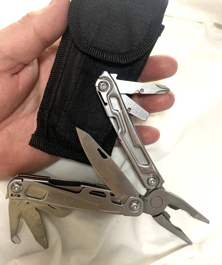 Leatherman REV Multitool knife plus generic pouch.