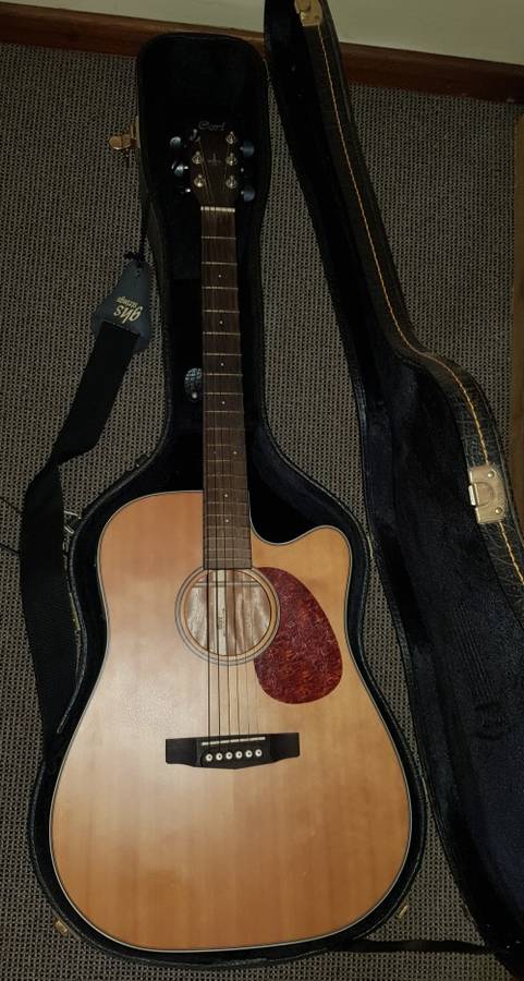 Cort Acoustic steel string Guitar with tuner/pickup and hard carry case