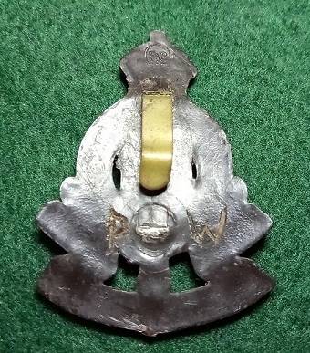 WW2 Royal Army Ordnance Corps Plastic Economy Cap Badge - only one lug