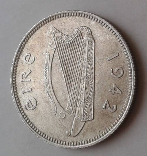 Top grade 1942 Ireland silver shilling in AU