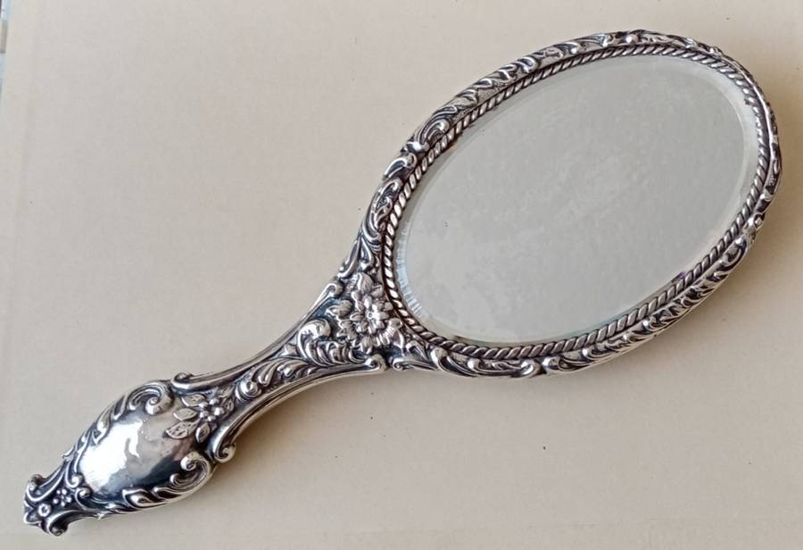 1902 Victorian hallmarked silver handheld mirror with floral design