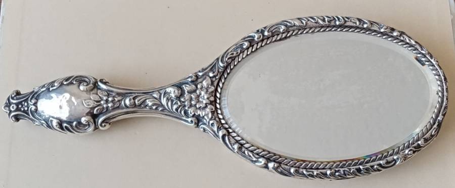 1902 Victorian hallmarked silver handheld mirror with floral design